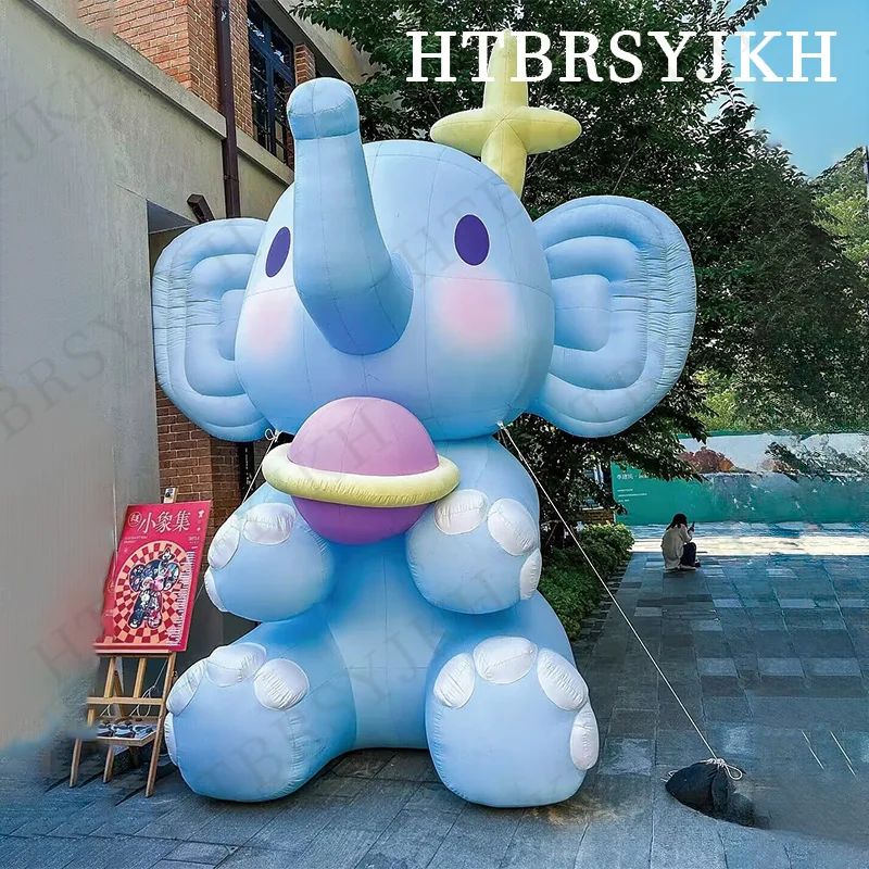 

Inflatable cartoon air model holding planet elephant air model shopping mall display activity decorative props