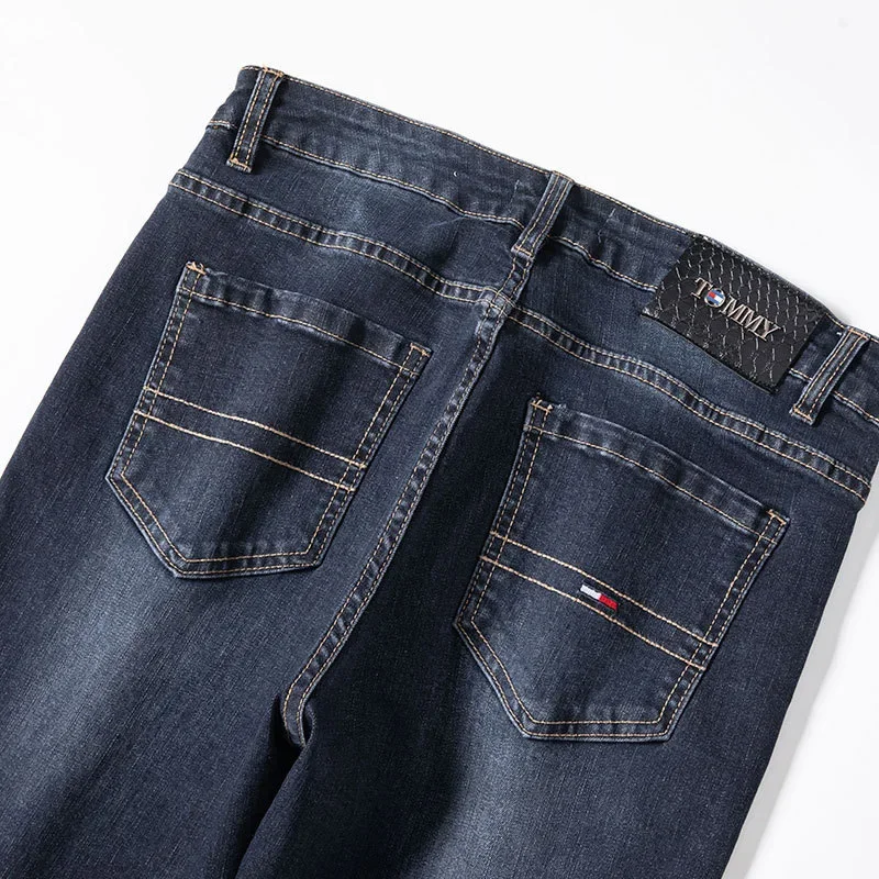 جينز رجالي من Tommu Overstock عالي الجودة على الطراز الأوروبي أزرق عميق للربيع والخريف بقصة ضيقة ينعم صورتك المستقيمة الساق