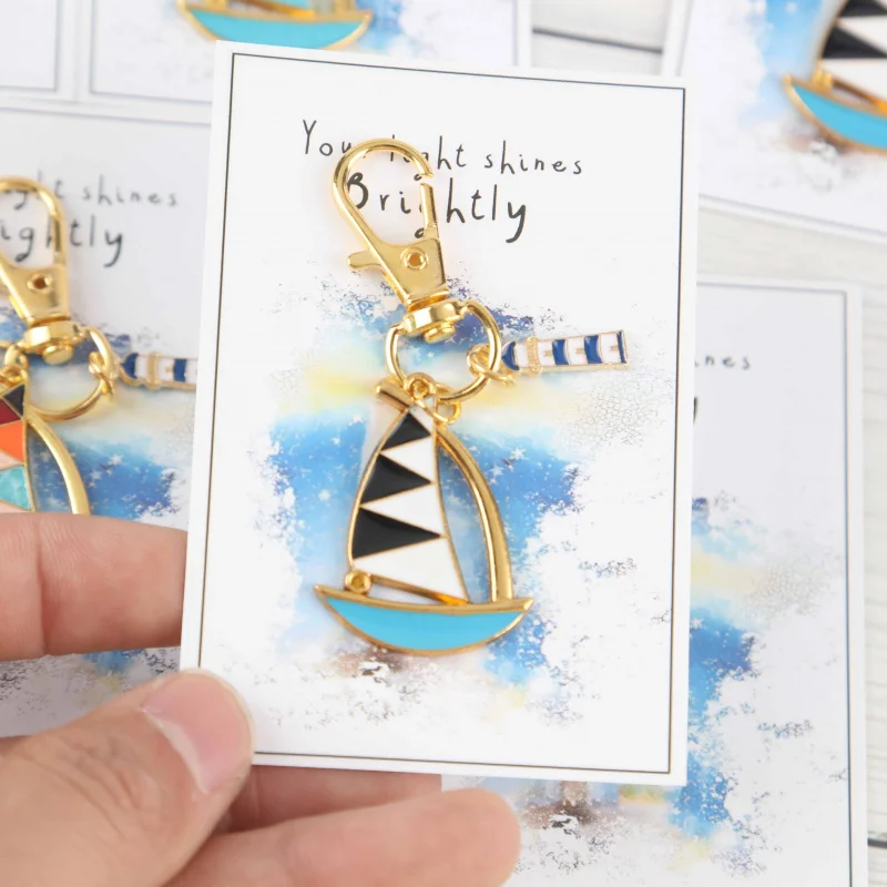 conjunto-de-3-6-chaveiros-2d-da-serie-barco-a-vela-e-farol-uma-mapa-chapa-iluminada-pela-sua-luz-enquanto-voce-avanca