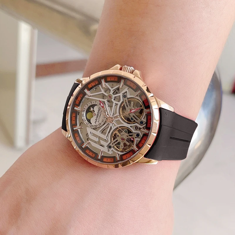 HANBORO ผู้ชายนาฬิกาอัตโนมัตินาฬิกาหรู 50M กันน้ําส่องสว่างนาฬิกาข้อมือ Hollout Out Dial Fly ล้อ Sapphire