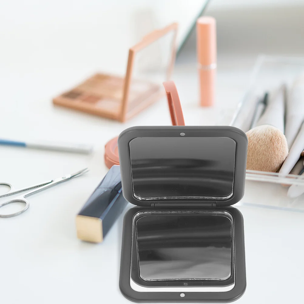 

Small Compact Makeup Mirror Foldable Portable Design Perfect for Travel Handbag Or Pocket Convenient Personal Use