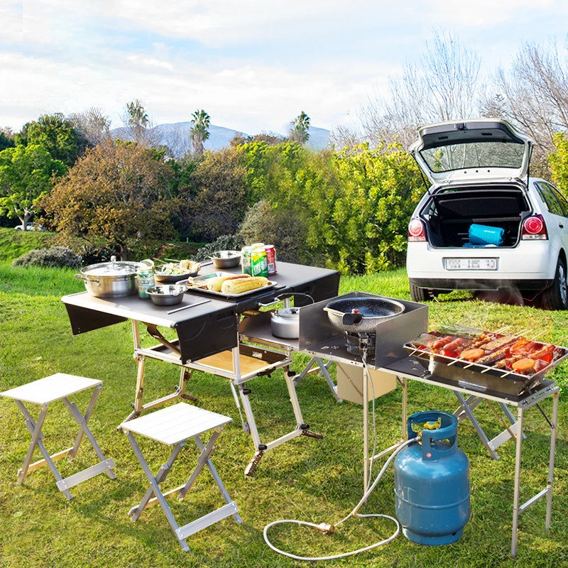 BBQ table, picnic table and chairs, portable mobile kitchen, folding stove, cooker, equipped field stove, car on