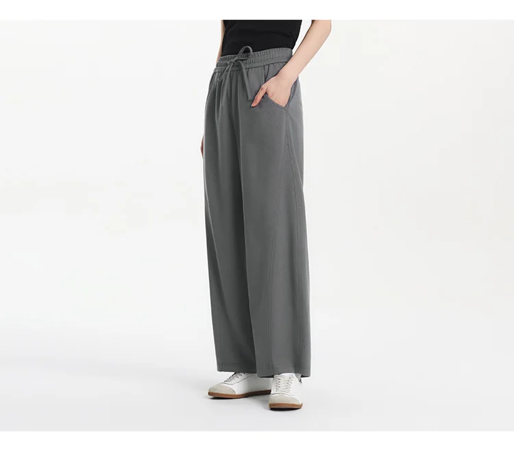 Damenhosen: Lässige, geschlitzte, lockere, geschwungene Slim-Fit-Hose im minimalistischen, vielseitigen Stil mit geschwungenem Bein – Sommermode 2026 für den Alltag – Detail 9