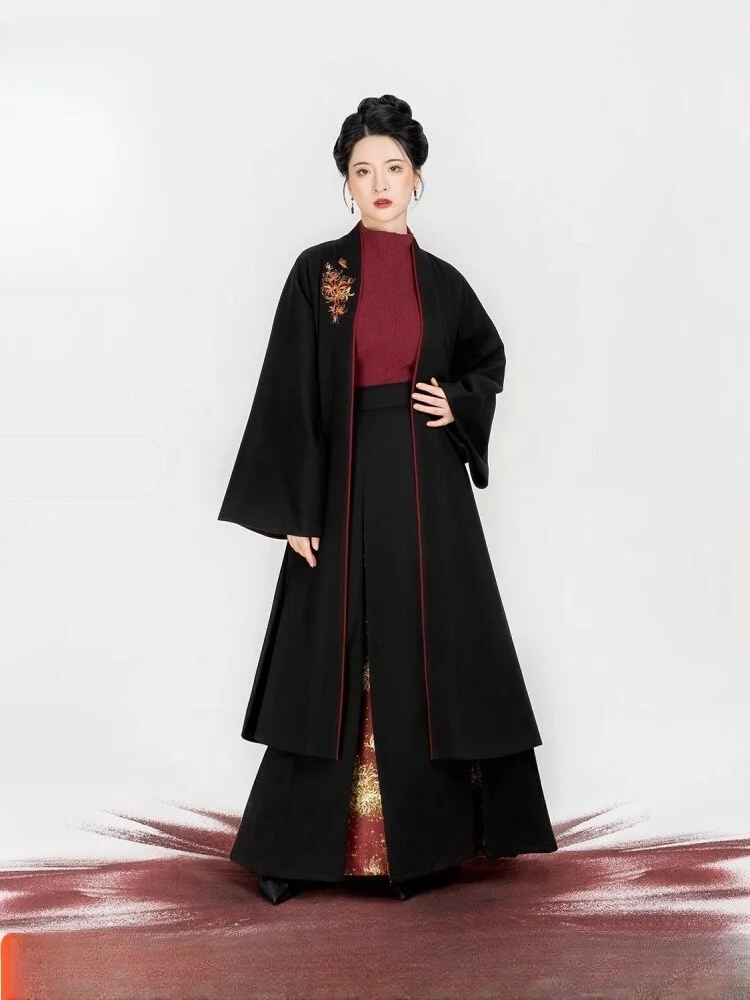

A woman wearing Hanfu embroidered front-opening coat with sweater and three-pleated skirt