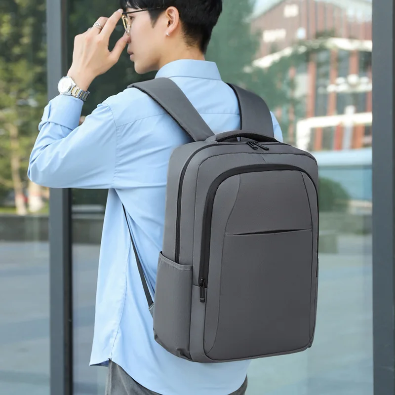 Europe and the United States new business commuter solid color backpack waterproof Oxford large capacity storage student bags.