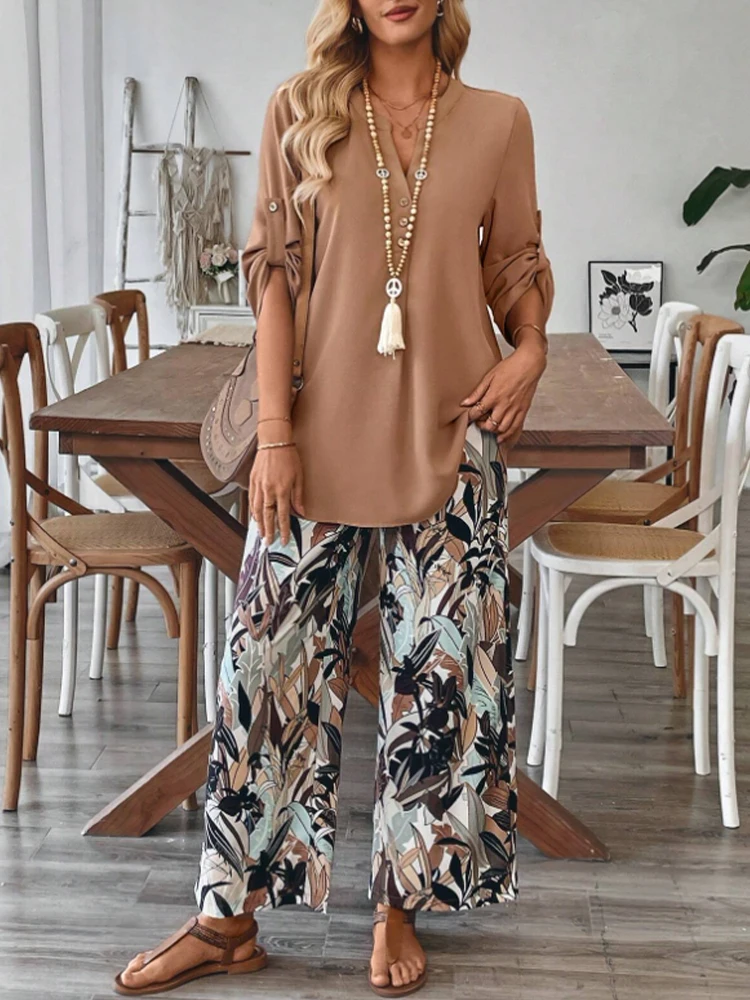 

Women's solid color V-neck ruffle sleeve village shirt and plant-print loose wide-leg trousers two-piece set