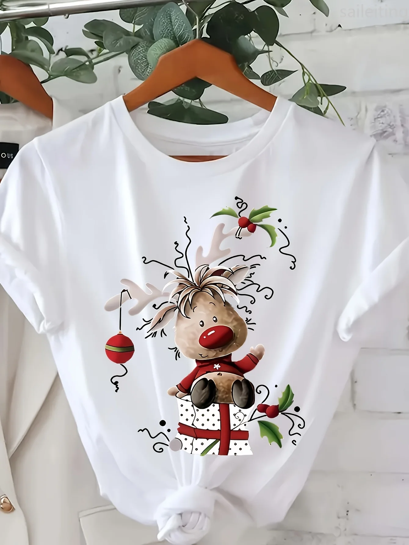T-shirt da donna con stampa grafica natalizia, maniche girocollo, top casual con renne festive e motivi natalizi, sfondo nero
