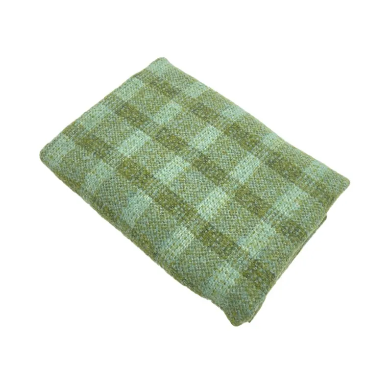 This is an elegant light green checkered woolen tweed fabric for a coat