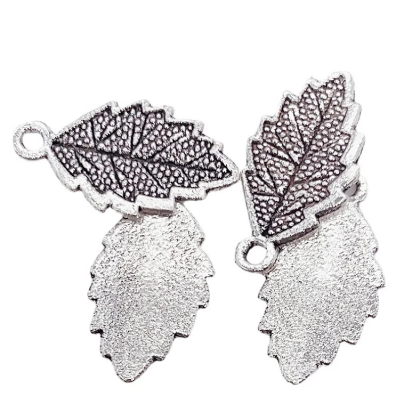 Factory Direct Sales 100Pieces DIYZinc Ornament Plant Leaves Feather Pendant 23*12MM Clothing Bags and Gifts