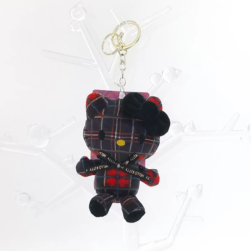 Breloczek Sanrio z kokardą i szalikiem w kratę, uroczy Hello Kitty, modny pluszowy wisiorek, idealny prezent dla kobiet i dziewcząt.