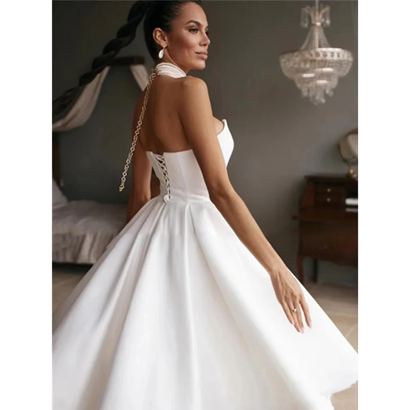 Biała suknia ślubna bez ramiączek dla kobiety, satynowa suknia wieczorowa w kształcie litery A, bez rękawów, elegancka sukienka na przyjęcie o długości do herbaty, szyta na miarę.