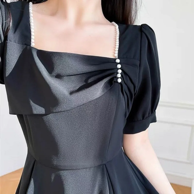 Black dress women's summer new high-quality temperament covered meat waist slim square neck fashion black dress.