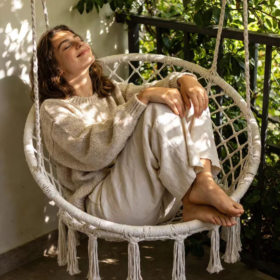 The new Bohemian-style outdoor camping garden hammock and chair set with accessories are used. The fringed design. Circular shap