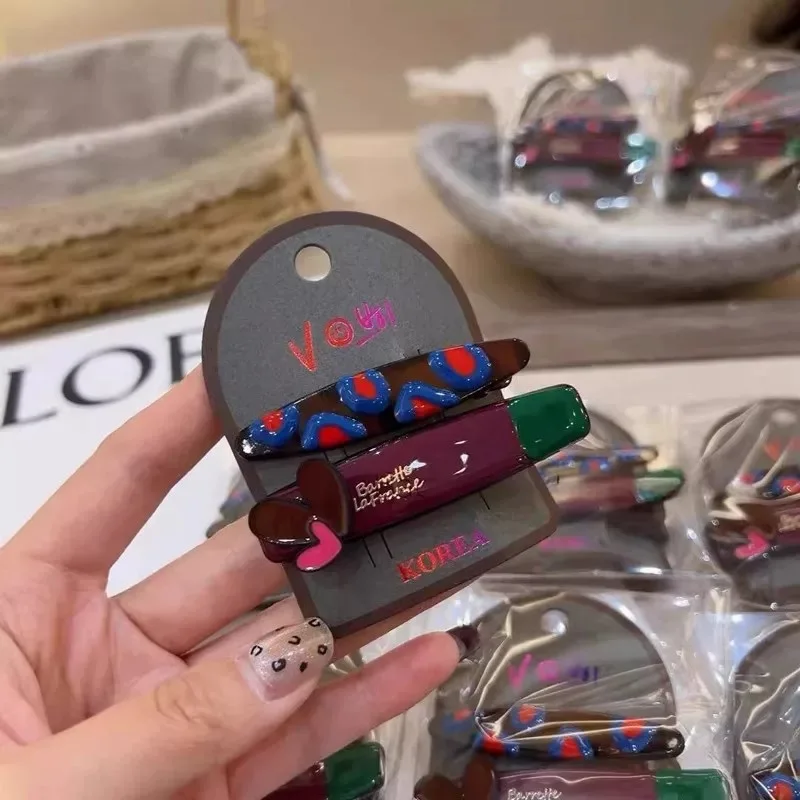 Korean version of the new fashionable color drip love bow letter hairpin sweet high sense side duck bill clip female