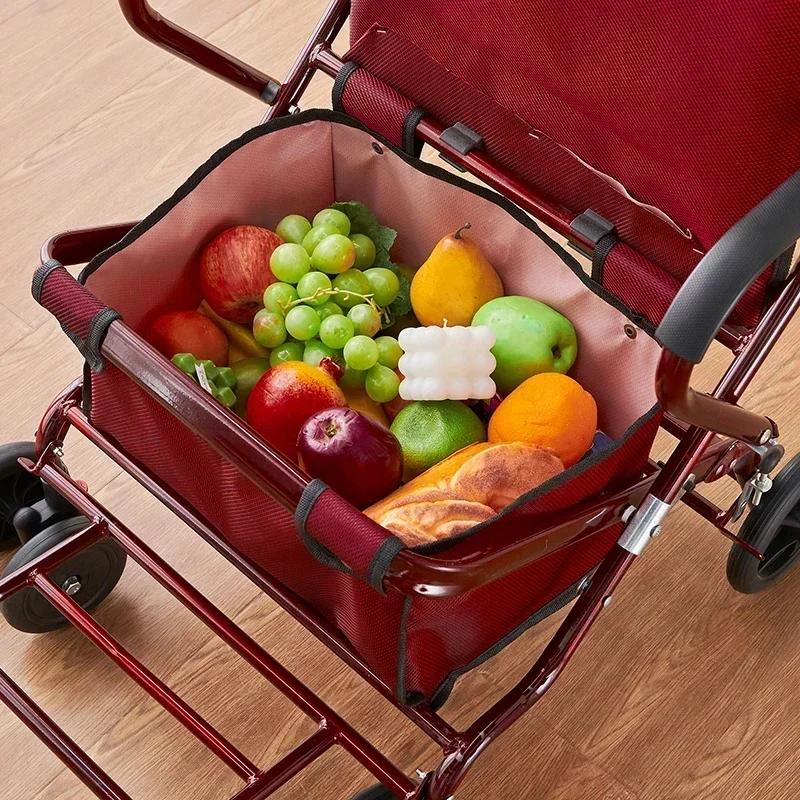 Lightweight elderly shopping cart can be pushed on four wheels to buy food The elderly trolley is safely widened and enlarged