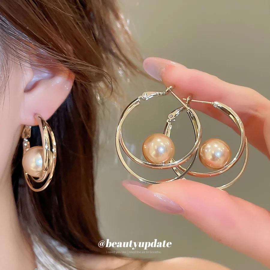 Double Ring Hoop Earrings Featuring Suspended Central Pearl Charm Delivering Modern Geometric Aesthetic For Sleek Office Attire