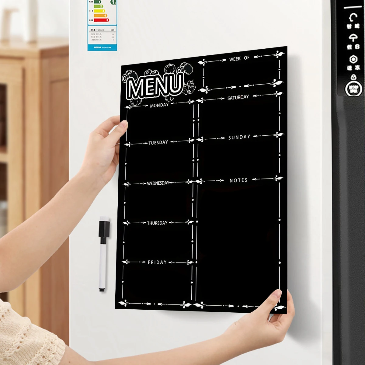 A magnetic refrigerator sticker with erasable soft whiteboard to prepare a weekly schedule for forgetting things