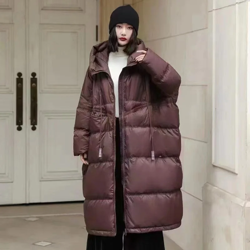 Inverno com capuz cordão solto puffer jaqueta feminina sólida oversize casual silhueta longo pato branco para baixo casaco quente 2024 novo casaco