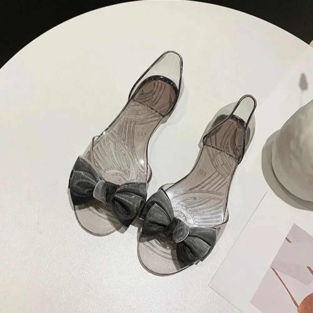 Повседневные тапочки, блестящие прозрачные сандалии, прозрачные шлепанцы, сандалии, нескользящие туфли на плоской подошве с бантом, женские летние туфли