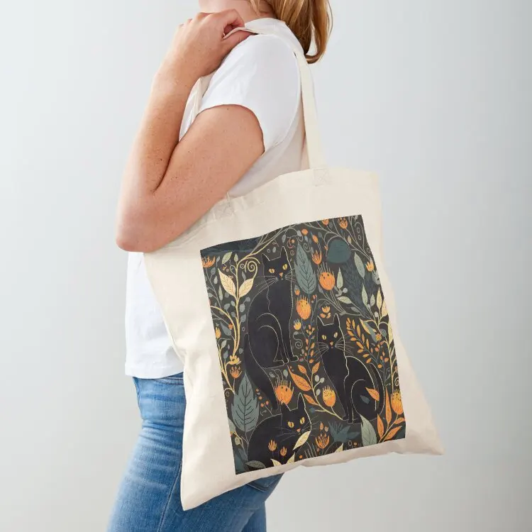 

Black cats among plants and flowers. Tote Bag tote bag custom cute pouch bag large size bags tote woman