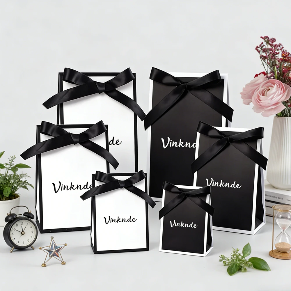 

Wholesale New Custom Logo Luxury Cosmetics Packaging Paper Bags Cardboard Shopping Gift Jewelry Perfume Paper Bags With Bow Tie