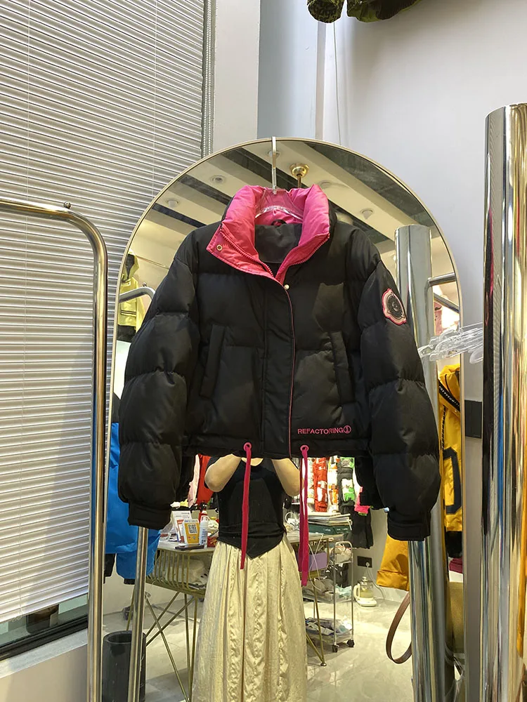 Chaqueta de plumón cálida con capucha para mujer, chaqueta de plumón de pato blanco a la moda con temperamento elegante, novedad de invierno de 2025