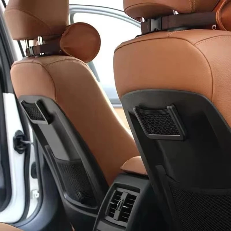 Car Pocket Phone Nets installed on center console holding phone