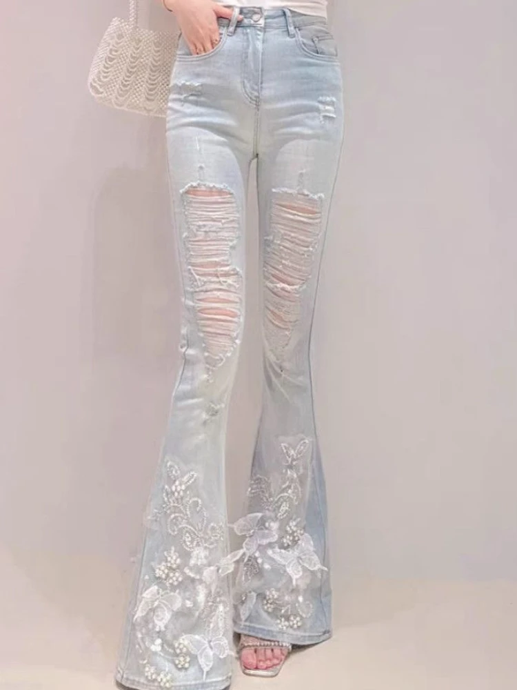

Large size nail bead butterfly ripped fashion jeans for women new high waisted slimming nine inch micro flared pants
