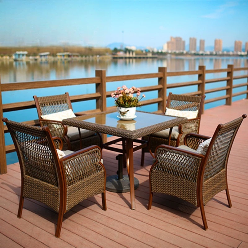Outdoor courtyard rattan tables and chairs villa terrace one and four  combination leisure hotel
