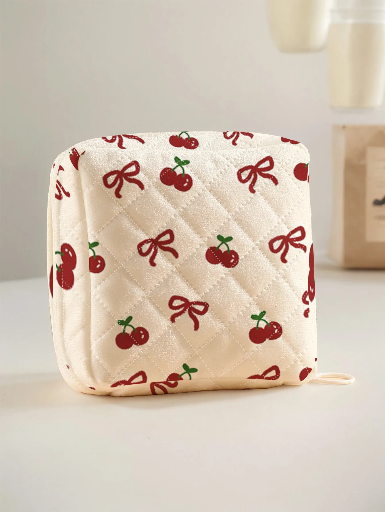 1 portable sanitary napkin storage bag, printed with red cherries and bowknots, diamond quilted fabric lightweight ladies tissue