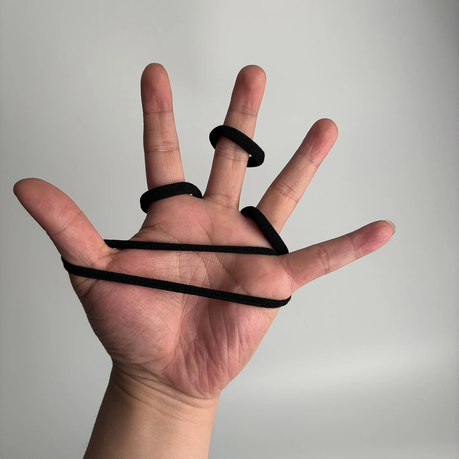 Multiple color options for the dust plugs. 50 pieces elastic seamless black hair ties, gentle on hair, lightweight ponytail holders, ideal daily hair accessories for ladies and girls. - Detail 1