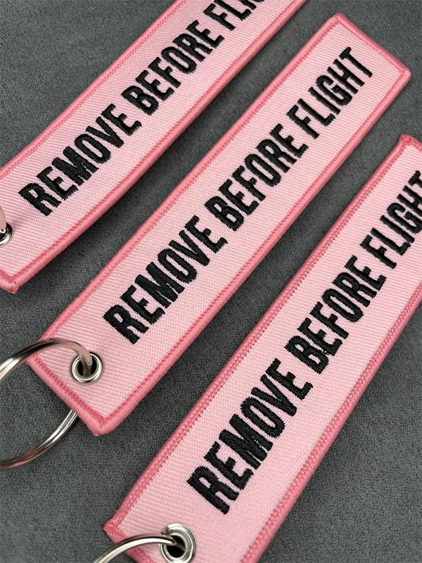 100Pcs Pink Remove Before Flight Woven Keychain Aviation Key Tag Metal Key Ring for Car Keys