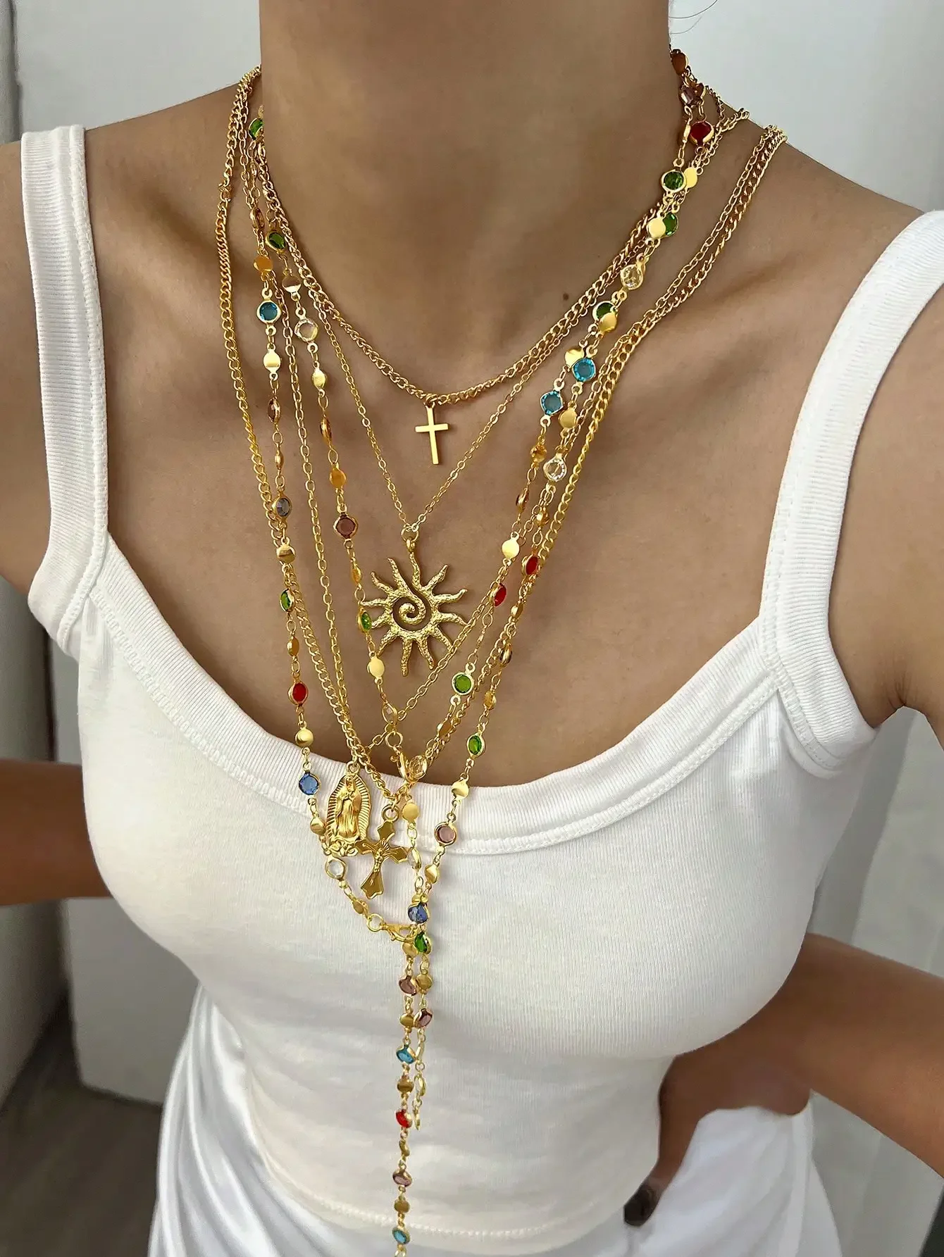 Layered Gold-Tone Pendant Necklace Set with Cross, Sun, and Gemstone Accents