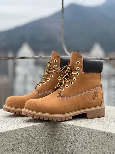 Zapatos de moda para hombre, botas amarillas de cuero genuino, botas impermeables informales para hombre 2025
