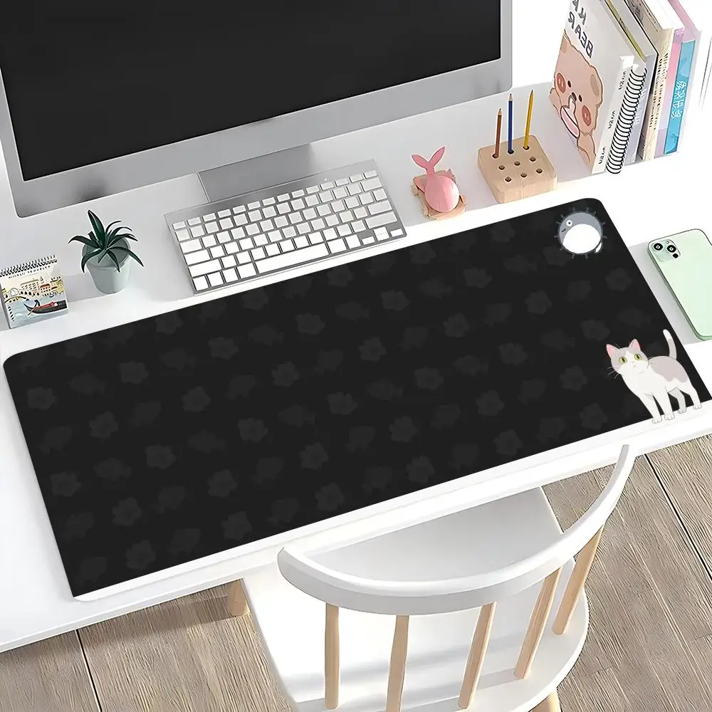 

Large mouse pad - Black background with cat - paw/fish patterns. Cute cartoon cat at the bottom right. Simple, playful.