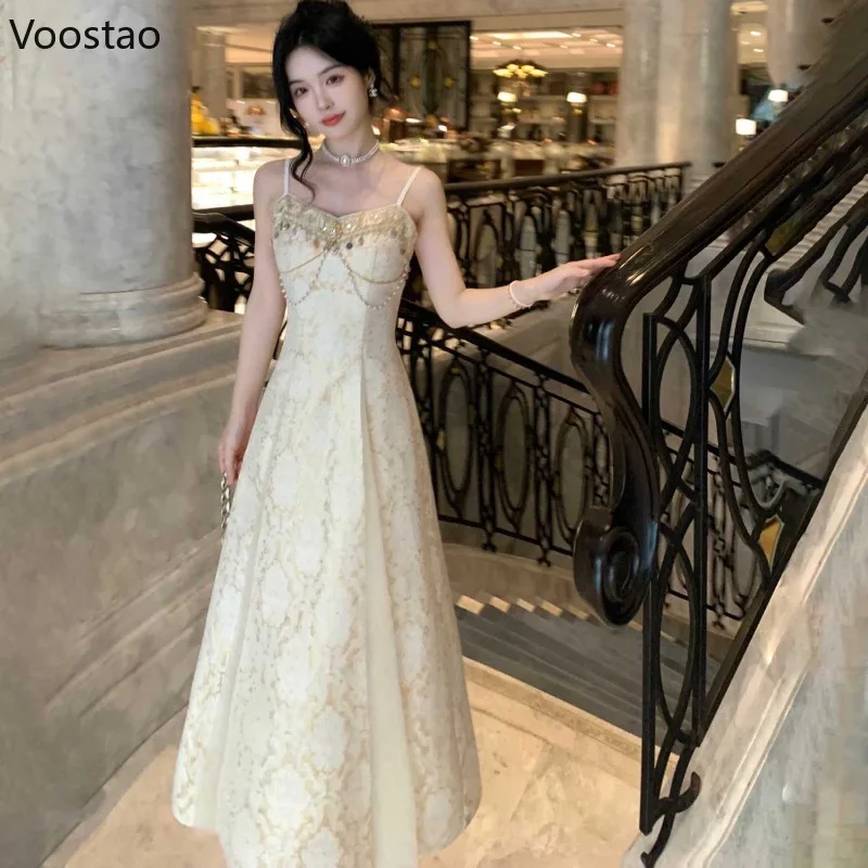 フレンチエレガントな海辺のホリデーパーティードレス女性甘いスパンコールパールチェーン妖精ロングドレスレディースビーチ自由奔放に生きる誕生日ドレス