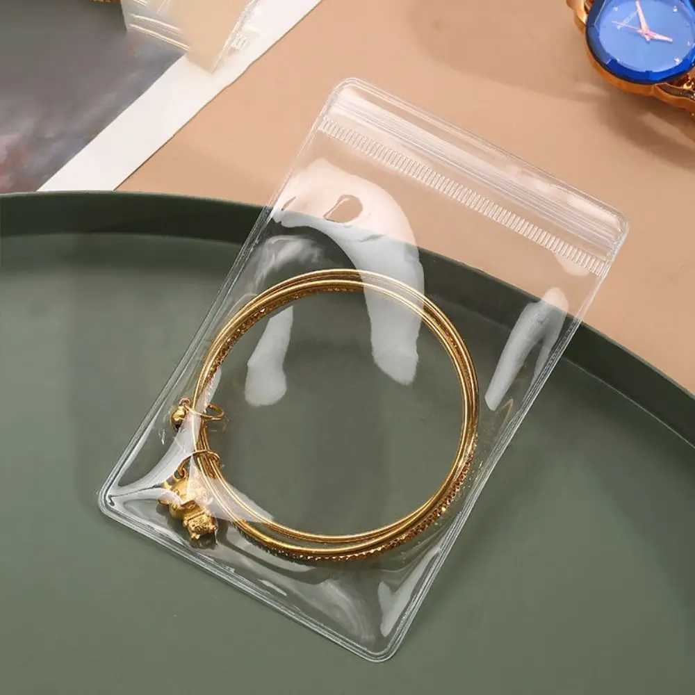 

Прозрачные пакеты для упаковки ювелирных изделий, изысканные футляры для сережек-гвоздиков, мешочки для хранения сережек и колец, антиокислительные футляры для украшений