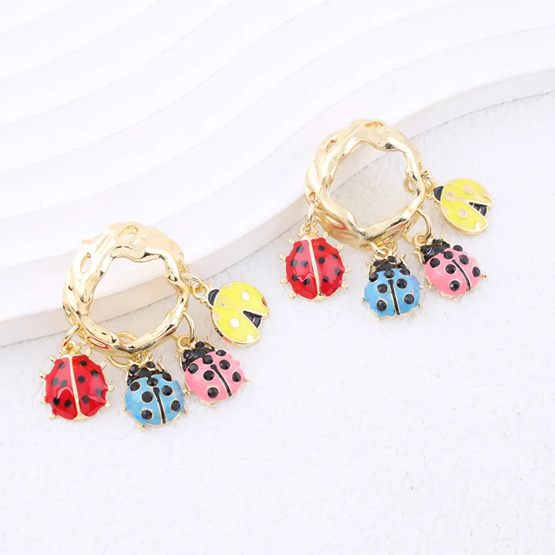 European and American style unique ladybug dangling tassel earrings with oil-drop pattern, perfect for vacation or travel.