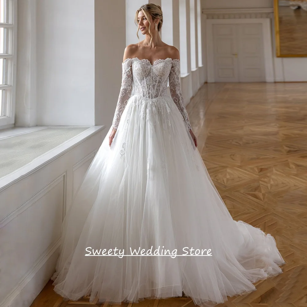Maßgeschneidertes Sweetheart-Brautkleid mit langen Ärmeln, wunderschönes, transparentes Applikations-Korsett-Brautkleid mit Schleppe für die Braut