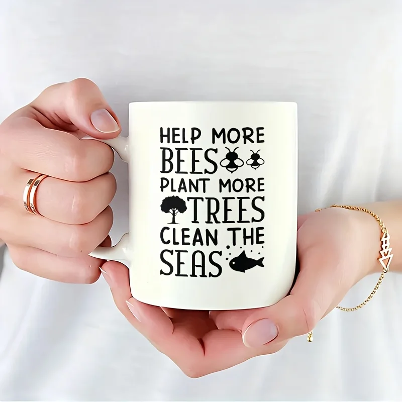 1 taza sencilla que promueve la ayuda a las abejas, la siembra de árboles y la limpieza de los océanos. Hecho de Cerámica