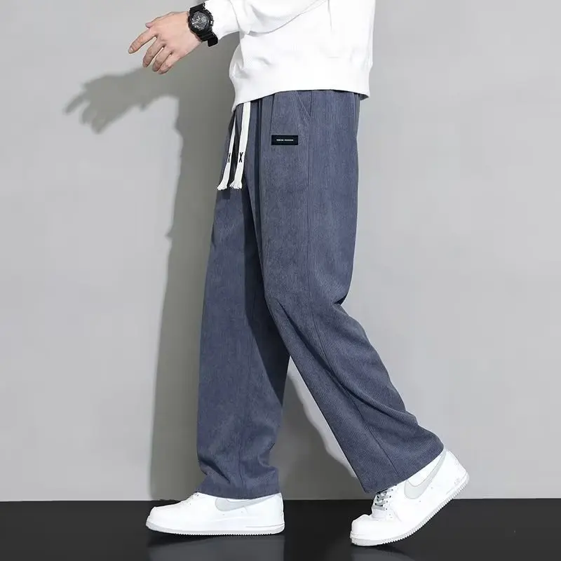 Primavera autunno moda temperamento coreano velluto a coste pantaloni a gamba larga uomo sciolto Casual tinta unita pantaloni sportivi maschili