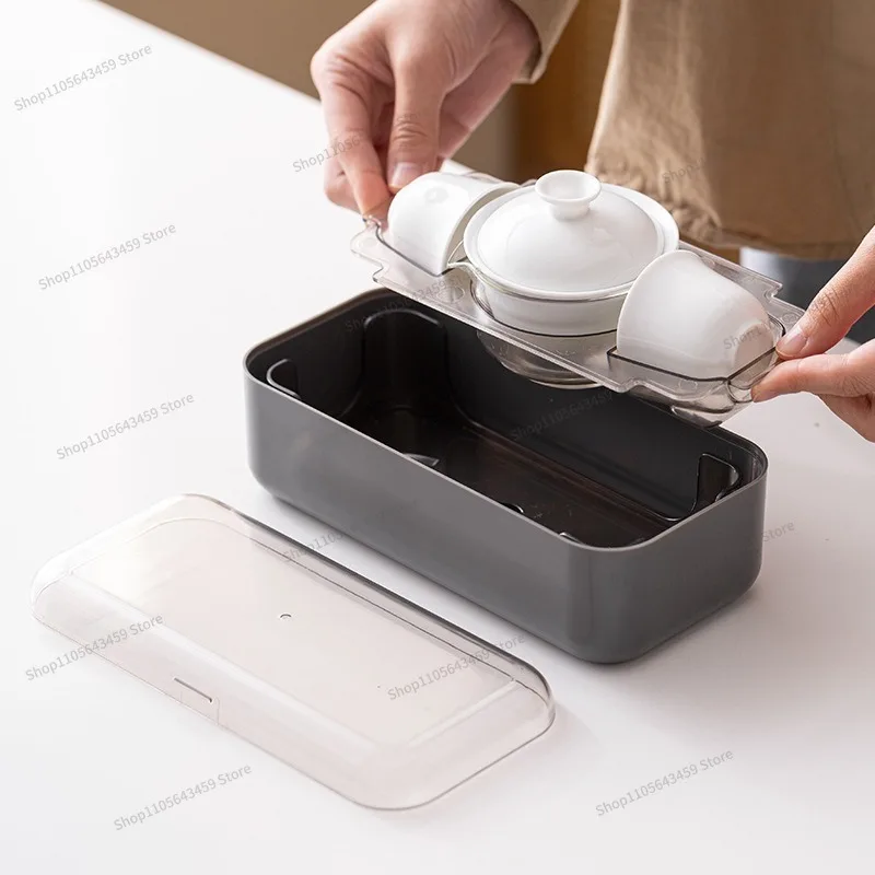 white porcelain travel tea set, one pot and three cups of portable express cup outdoor souvenir