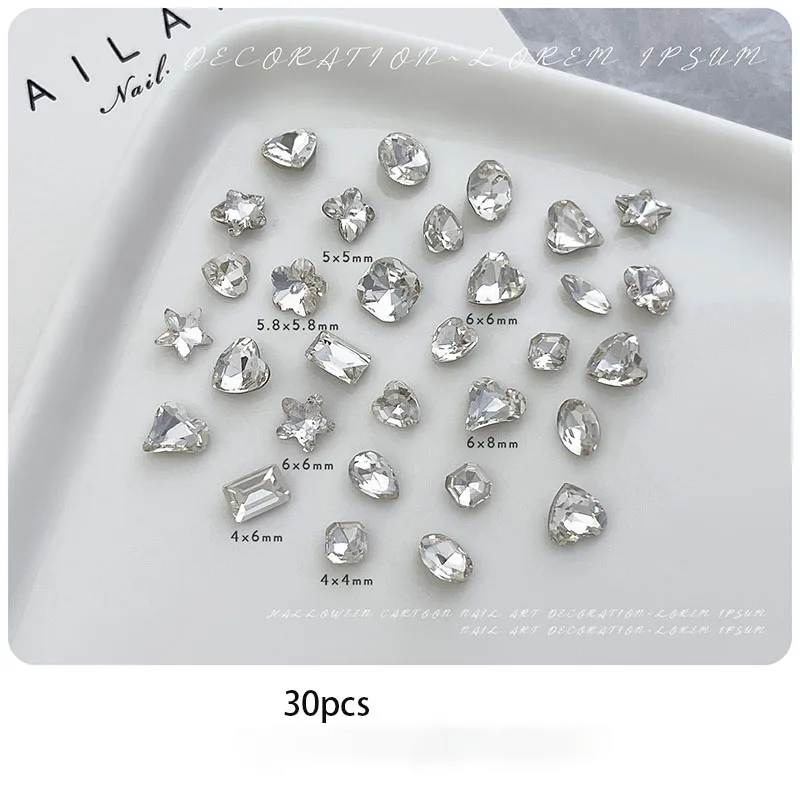 Pointed-bottom, irregular-shaped diamond nail accessories mixed with dazzling white and pink champagne heart-shaped water drop