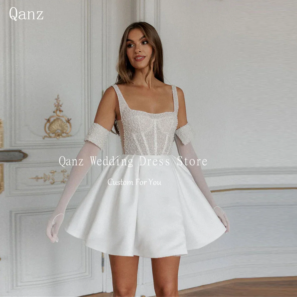 Qanz สีขาว Beadings ชุดแต่งงานสั้นสปาเก็ตตี้ Robe De Mariée Lace Up Vestidos De Boda Para Fiestas ที่กําหนดเอง