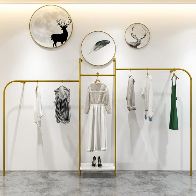 Custom, wall mounted gold metal hanging rack for clothing store showroom display stand furniture