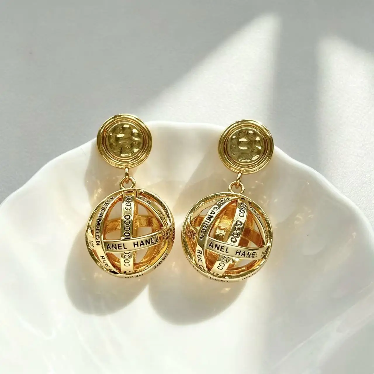 Retro hollow globe letter earrings niche design sense metal spherical earrings Internet celebrity earrings wholesale
