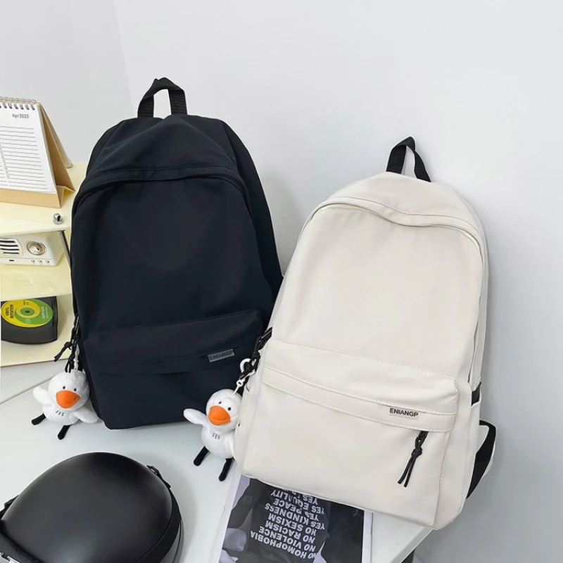 

Unisex Large Capacity Solid Color Backpack，Multifunctional and simple black travel backpack