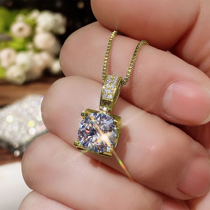 Elegant geometric zircon pendant necklace crafted in copper with brass plating finish featuring round gemstone accent on slub ch