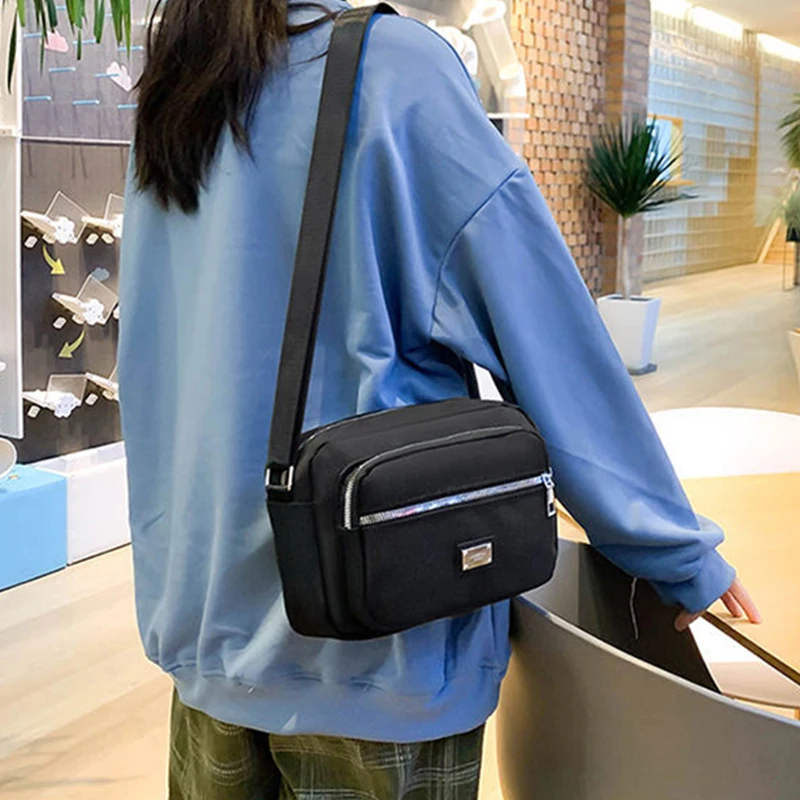 男性と女性のためのニュートラルスタイルのバックパック。女性用ハンドバッグ。ショッピングや写真撮影に最適。ポケットが複数あり。