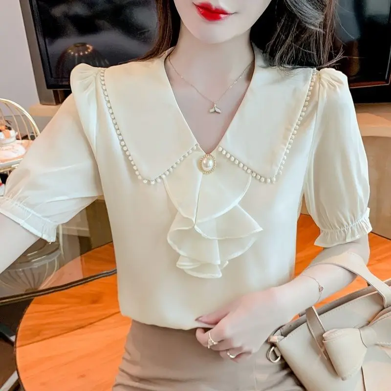 

2023 New Summer Temperament Pleated Chiffon Solid Color Peter Pan Collar Short Sleeve Blouse Ladies Korean Patchwork Shirts Tops